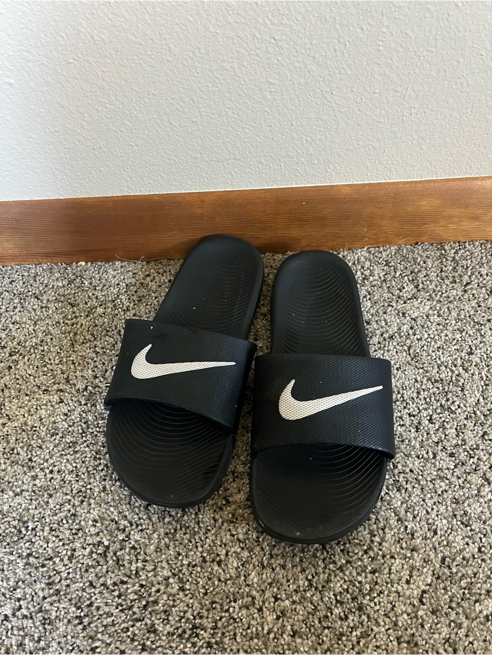 Nike Black Slides with White Swoosh Logo